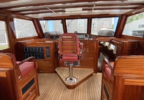 Varnished wooden helm station of a custom launch